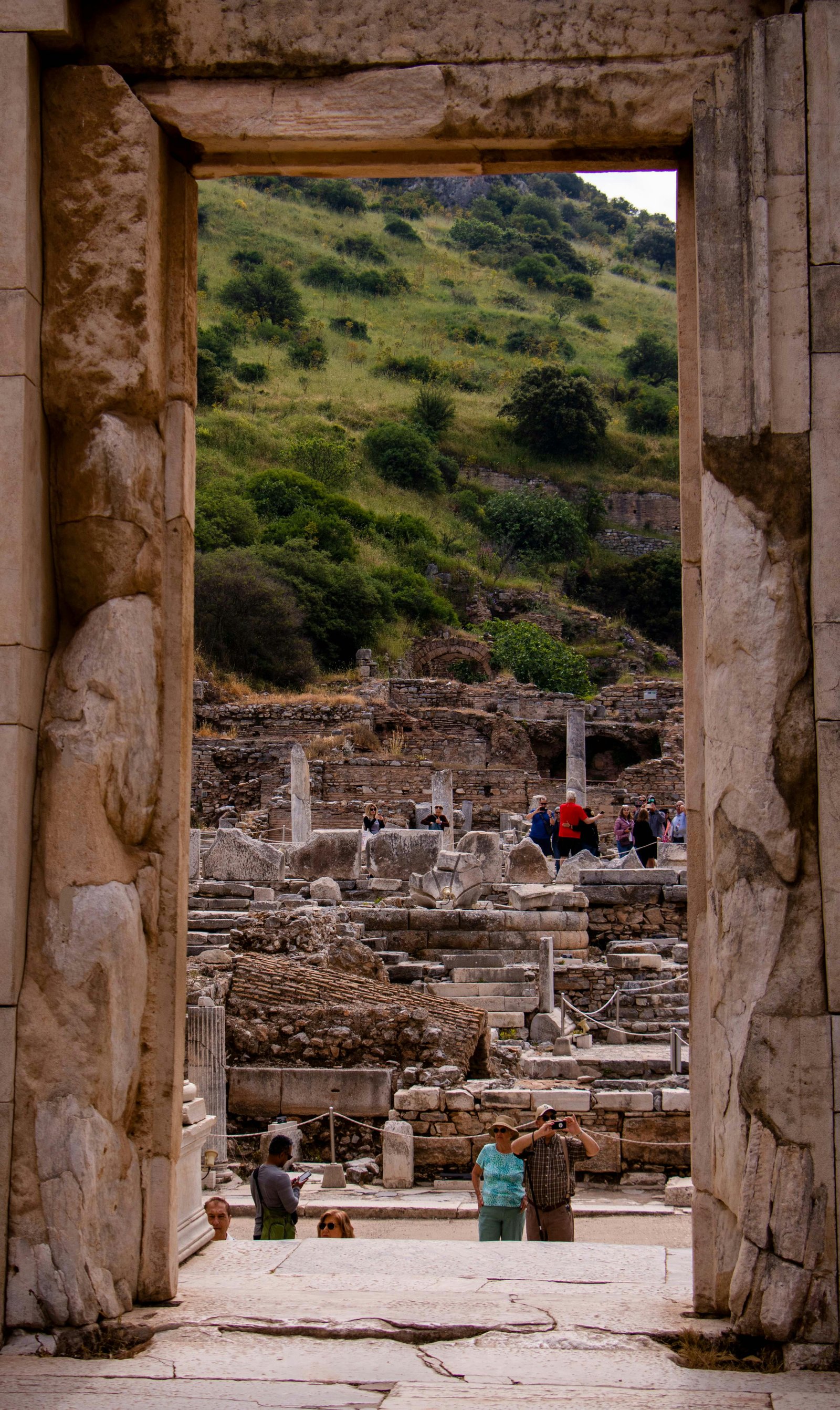 A small group of travelers exploring ancient ruins